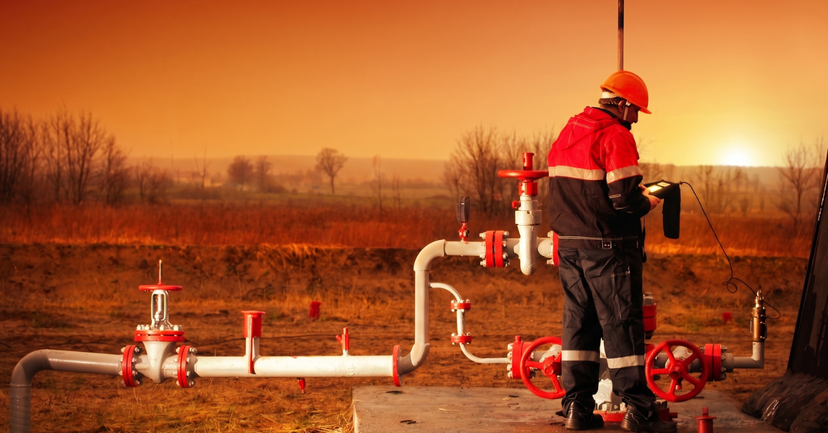 Gas production worker checking gas levels